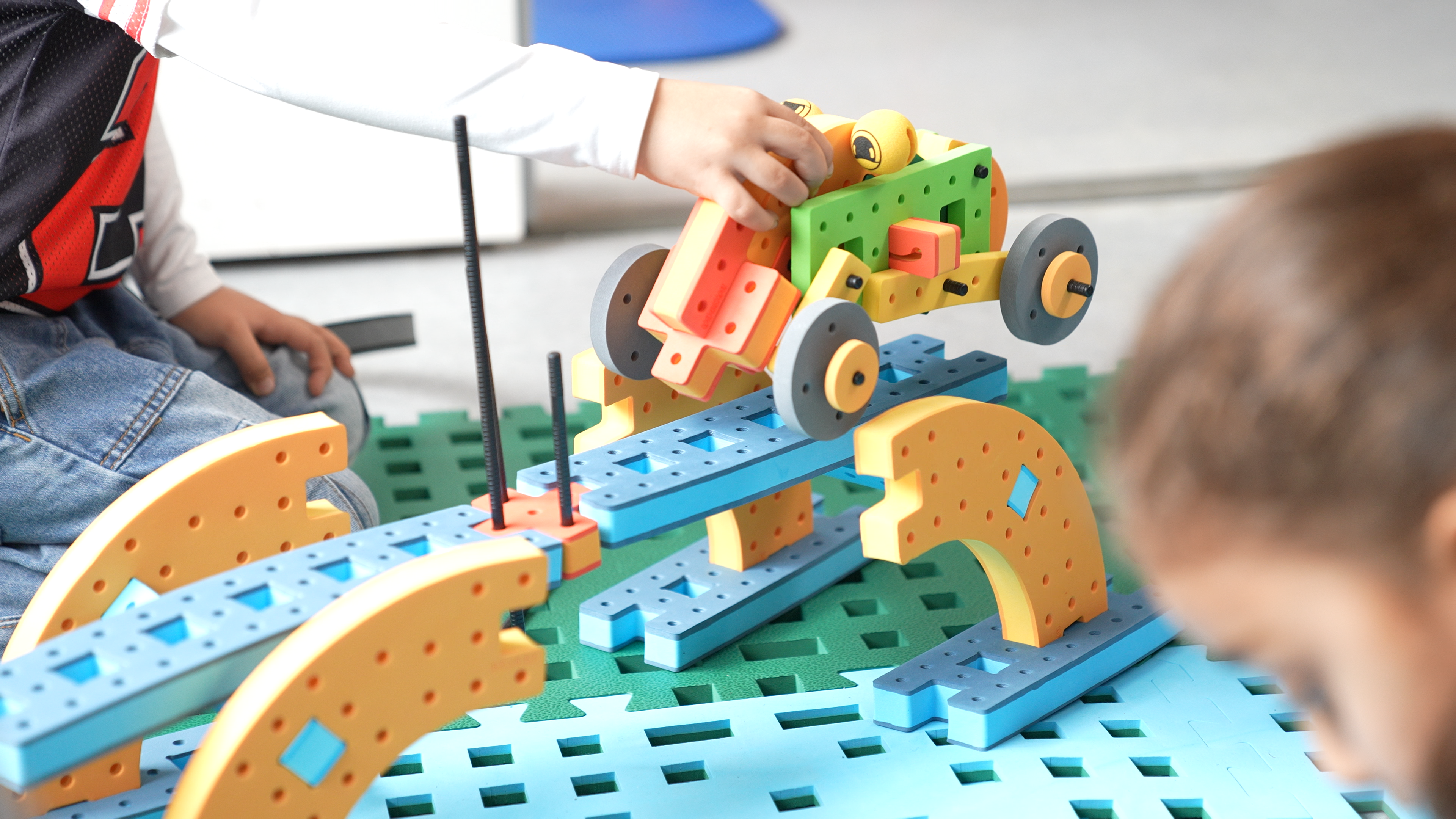 Various BAKOBA structures showing wide bases, tall towers, and angled designs, illustrating early engineering and physics concepts.